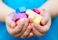Child's hands holding colored chalk pieces Royalty Free Stock Photo