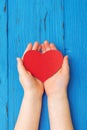 Red heart in child`s hands Royalty Free Stock Photo