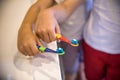 Child`s hands holding toothbrush on pink backgroubd. Healty care teeth concept. Copy space for your text Royalty Free Stock Photo