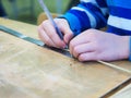 child's hands on the ruler mark size of the product Royalty Free Stock Photo