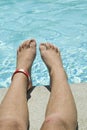 Child's Legs on Side of Pool Royalty Free Stock Photo