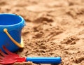 Child's Plastic Bucket and Rake in Sand