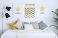 Child`s room interior with bed and posters on wall Royalty Free Stock Photo