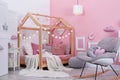 Child`s room interior with comfortable bed Royalty Free Stock Photo