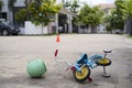 The child`s small bicycle fell to the ground with a helmet Royalty Free Stock Photo