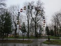 Child`s swing machine on the autumn. A toy car for children in the yard.