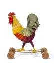 Child's toy a chicken rooster on wheels antique vintage Royalty Free Stock Photo