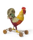 Child's toy a chicken rooster on wheels antique vintage Royalty Free Stock Photo