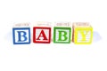 Child`s wooden blocks spell baby