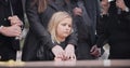 Child, sad and family at funeral at graveyard ceremony outdoor at burial place. Death, grief and group of people with Royalty Free Stock Photo