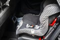 Child safety seat in the back of the car. Baby car seat for safety. Car interior. Car detailing. Child safety concept. Royalty Free Stock Photo