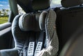 Child safety seat in the back of the car. Baby car seat for safety. Car interior. Car detailing. Royalty Free Stock Photo