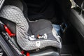 Child safety seat in the back of the car. Baby car seat for safety. Car interior. Car detailing. Royalty Free Stock Photo