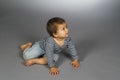 Child in sailor's striped vest crawl