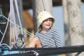 Child sailor traveling on sea yacht