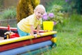 Child in sand box. Kid playing with sand Royalty Free Stock Photo