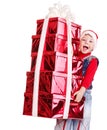 Child in Santa hat with stack gift box. Royalty Free Stock Photo