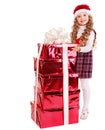 Child in Santa hat with stack gift box. Royalty Free Stock Photo