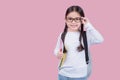 Portrait child school girl on pink background