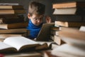 Child in school library. Kids read books. Little boy reading and studying. Children at book store. Smart intelligent preschool kid Royalty Free Stock Photo