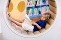 Child in school library. Kids reading books Royalty Free Stock Photo