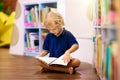 Child in school library. Kids reading books Royalty Free Stock Photo