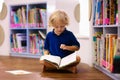 Child in school library. Kids reading books Royalty Free Stock Photo