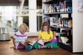 Child in school library. Kids reading books Royalty Free Stock Photo