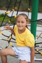 Child at school playground. Little girl has on gym activity center of preschool play ground. Healthy outdoor activity for kids. Royalty Free Stock Photo