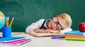 Child   schoolboy boy student tired, asleep about school blackboard Royalty Free Stock Photo