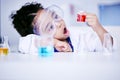 Child, science and chemistry with wow chemical in a laboratory for test or research. Face of African kid student shock Royalty Free Stock Photo