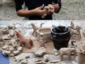 The child sculpts clay figures in the open air Royalty Free Stock Photo