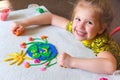 Child sculpturing plasticine planet for earth day. Protection of environment, Save our planet. Ecology concept. Concept of art Royalty Free Stock Photo