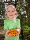 The child with sea-buckthorn berries