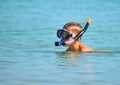 The child in the sea with the marine tube. scuba diving at sea. The boy in the glasses on the ocean Royalty Free Stock Photo