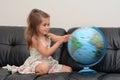 Child Search and Examining the Globe Royalty Free Stock Photo