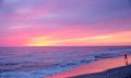 Child on the beach with spectacular sunset