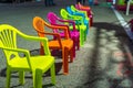 Child seats of various colors in a row