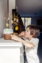 Child secretly eating Easter cake decoration topping at home