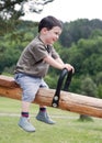 Child on seesaw
