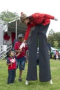 Toronto, Ontario / Canada - July 01, 2013: Child shack hand with a Canadian Mountie in the Canada Day parade Royalty Free Stock Photo