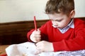 Child sharpens pencil Royalty Free Stock Photo
