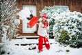 Child shoveling winter snow. Kids clear driveway. Royalty Free Stock Photo