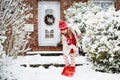 Child shoveling winter snow. Kids clear driveway