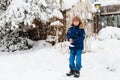 Child shoveling winter snow. Kids clear driveway