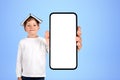 Child showing at large phone mockup display on blue background