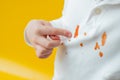 The child showing points a finger at the ketchup stain on clothes. daily life stain concept