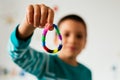 Child showing rubber bracelet