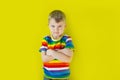 A grim, hurt child stands near the wall. Green background.