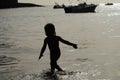 Child silhouette at sea